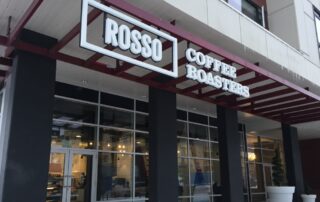 Coffee shop exterior with signage.